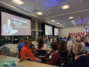 The whole group listening to a speech from Toyota representative