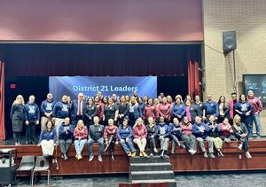 District 21 Leadership on a stage