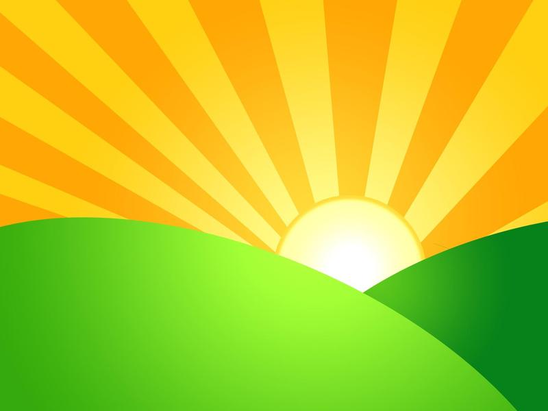 Sun rising over a hill