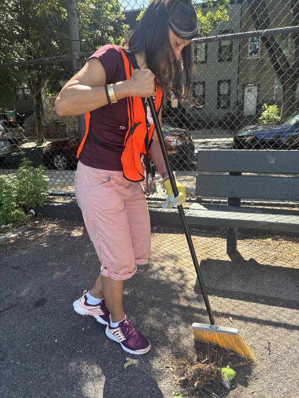 Staff member sweeping