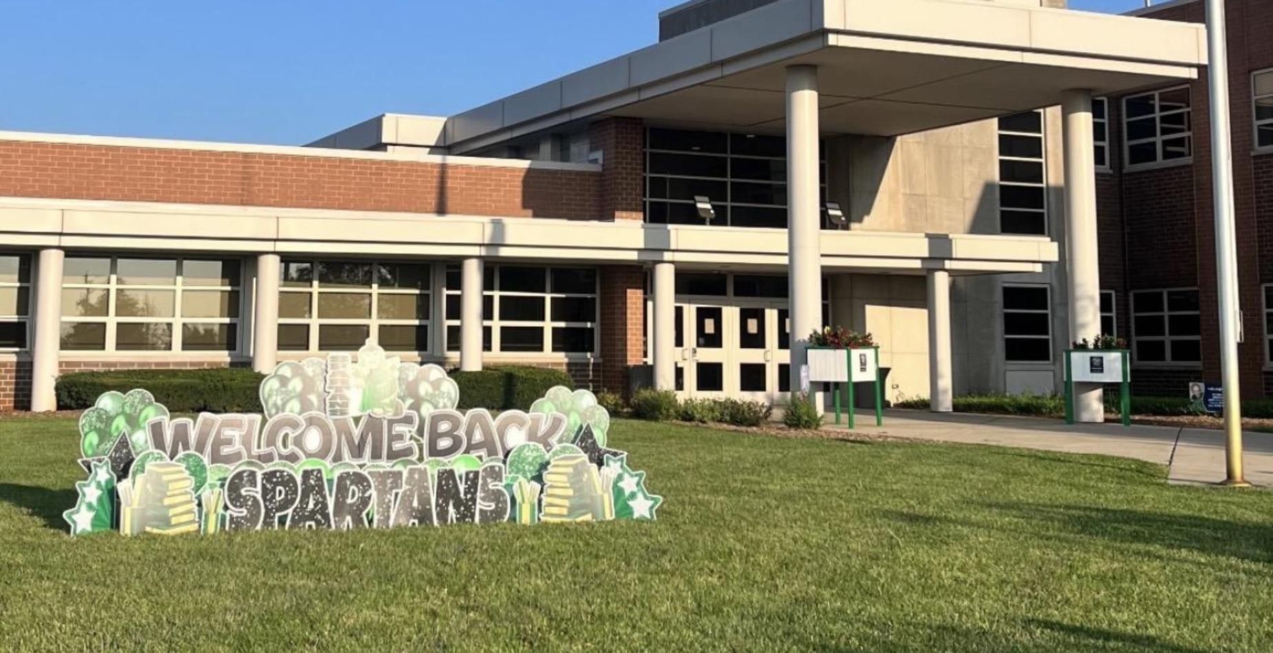 Welcome Back Spartans signage in front of the school.
