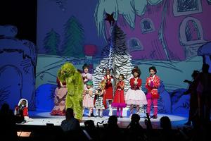 A group musical performance from The Grinch the Musical