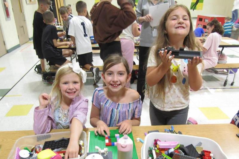 Eden and Isla Scott and Harper Shriver play with legos together