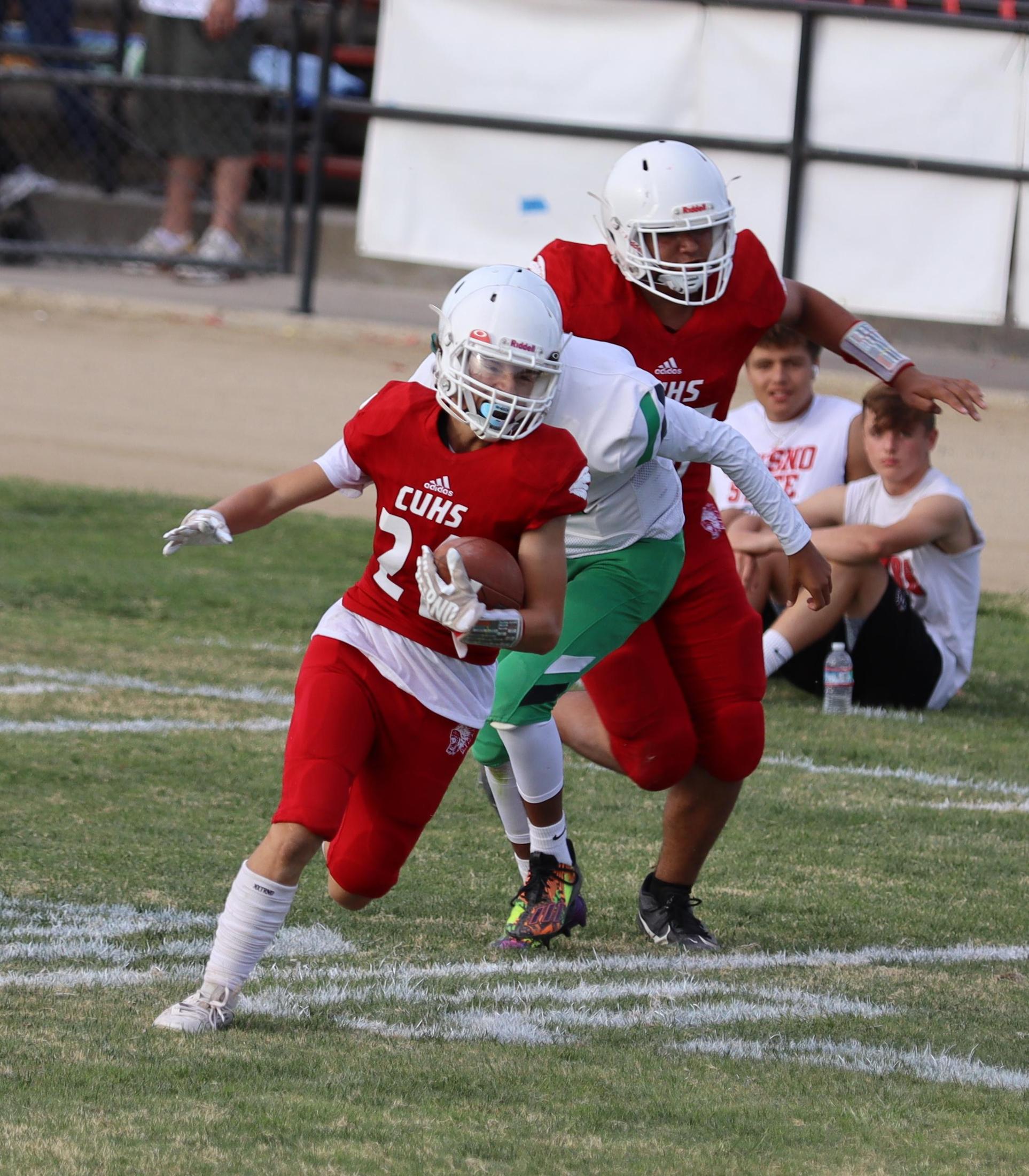  junior varsity football players in action against riverdale