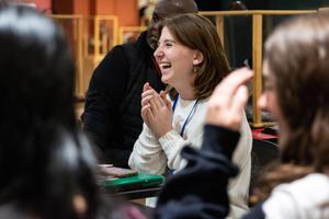 Students discuss around a table