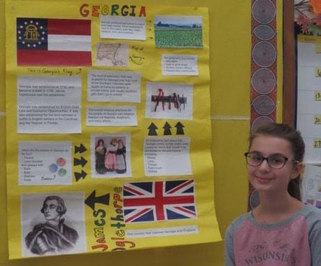 student with Social Studies project