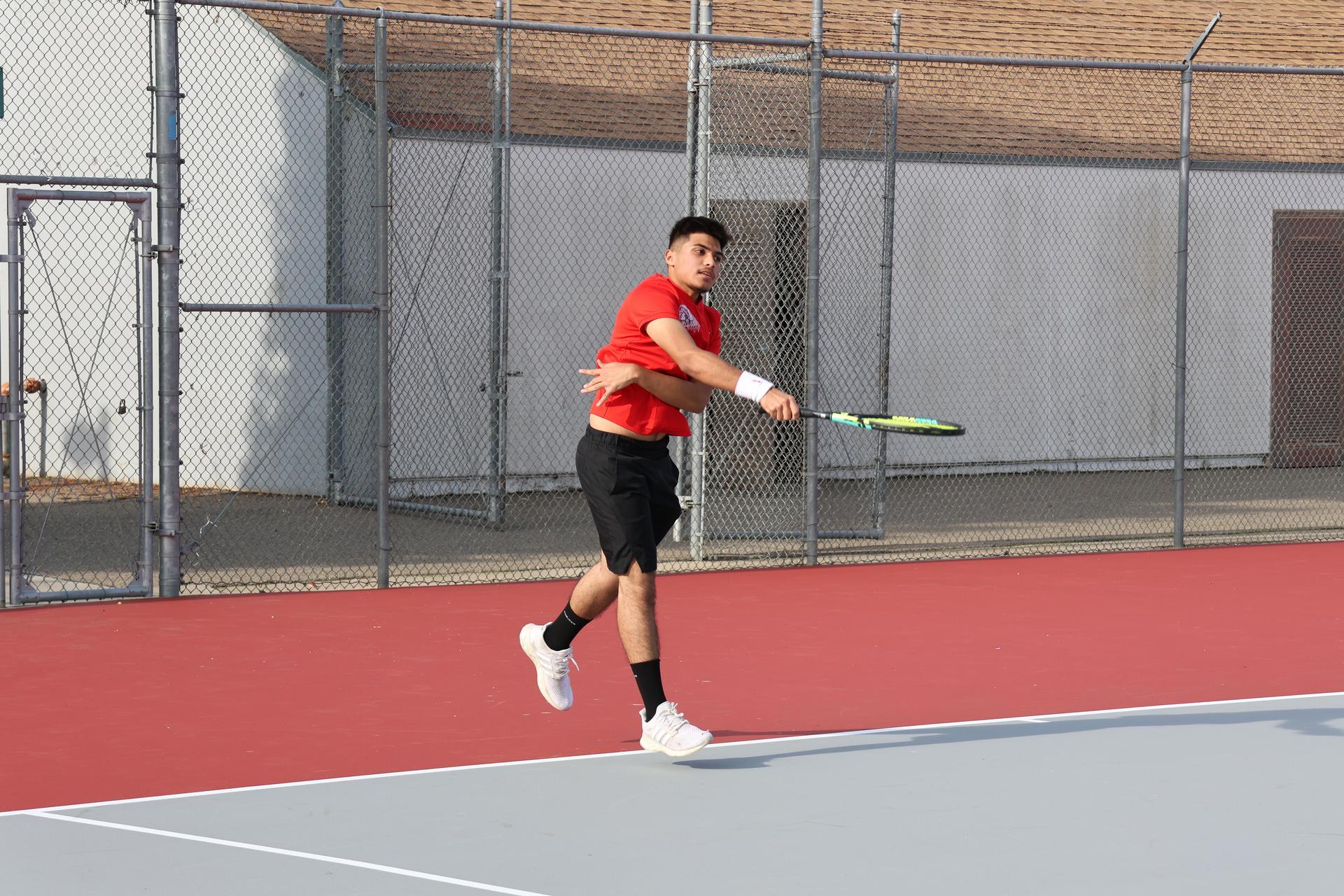 CUHS Boys playing tennis against coalinga