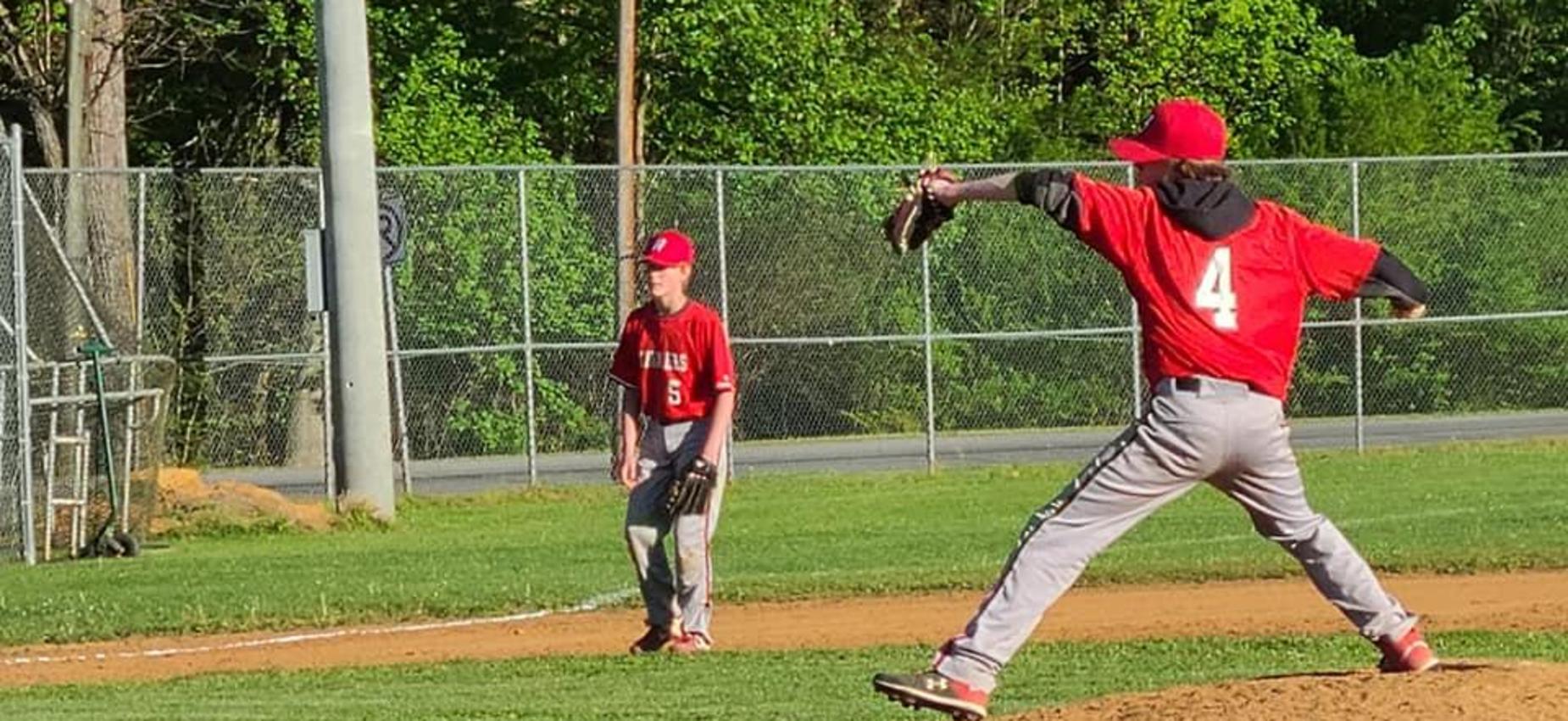 A pitcher throws a baseball.