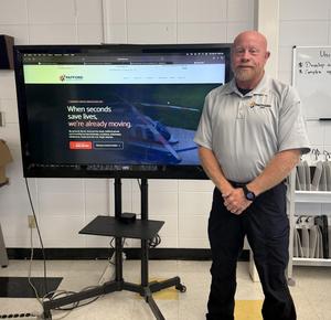 Bryan McCarty of Pafford Medical Services stands in front of tv in the CCR classroom