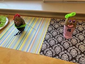 Two whimsical potato characters with accessories, placed on patterned backgrounds.