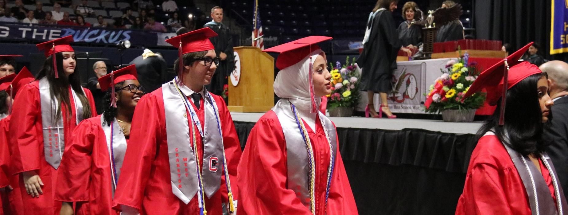CHSW students walking in front of the stage to get their diplomas.