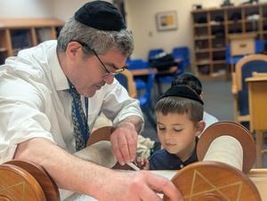 Boy looking at torah