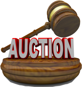 Brown gavel resting on a wooden platform with bold red 'AUCTION' text.