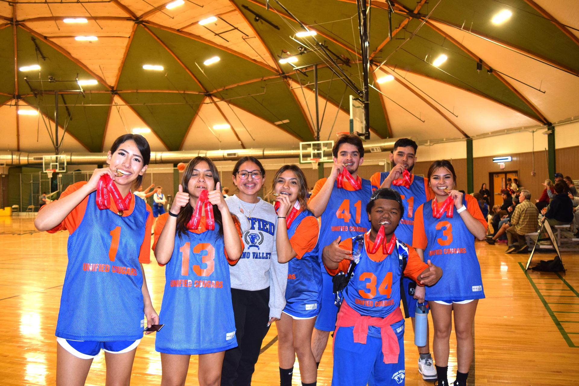 group of unified sports participants showing off their medals