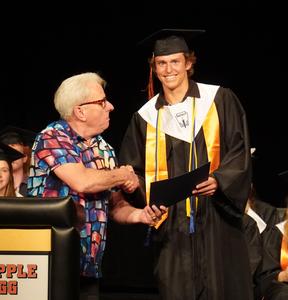 Walter Ball presents one of four Ball family scholarships to Frank Wilkinson.