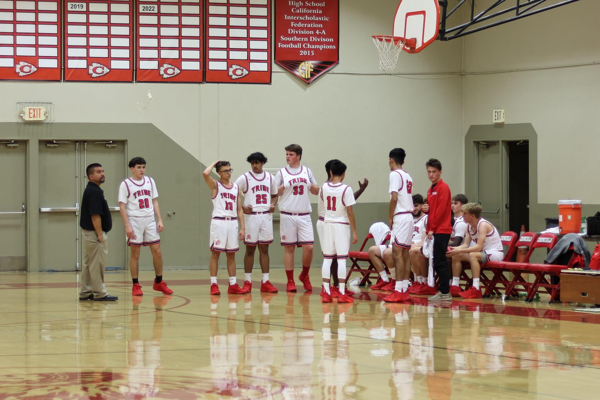 varsity boys basketball playing against sierra