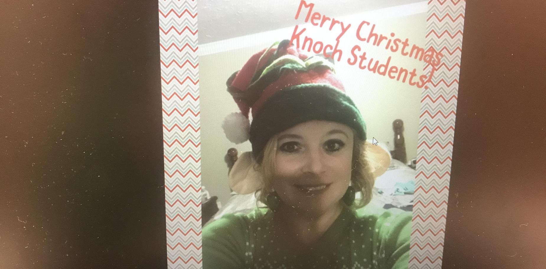 Mrs. White in elf hat