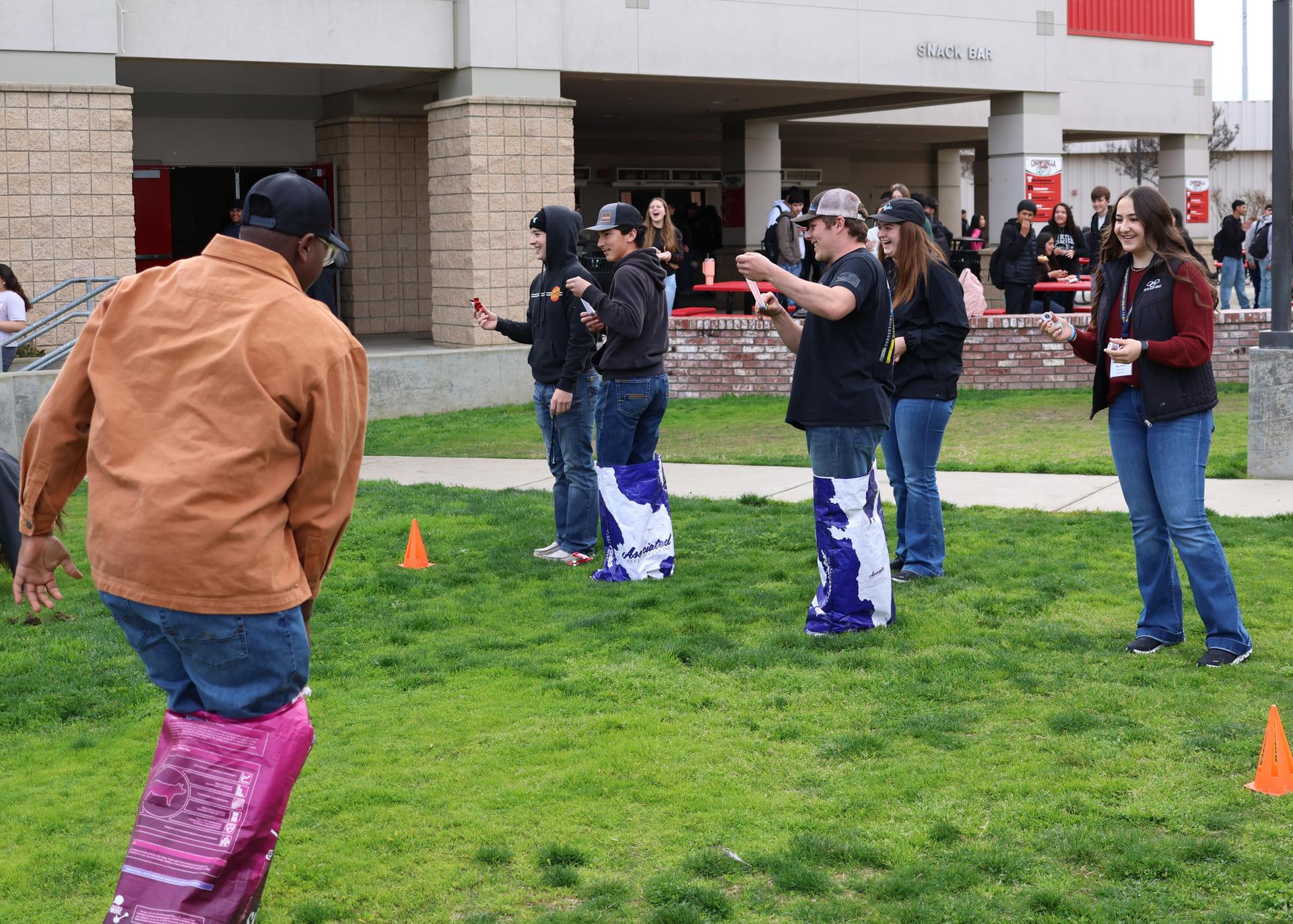 students and staff enjoying the feed bag relay