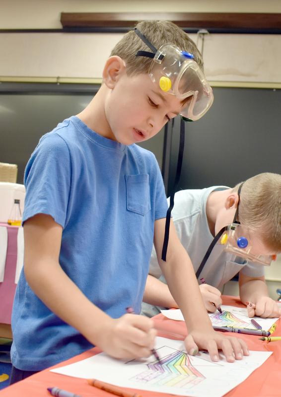 young students conducting science experiments