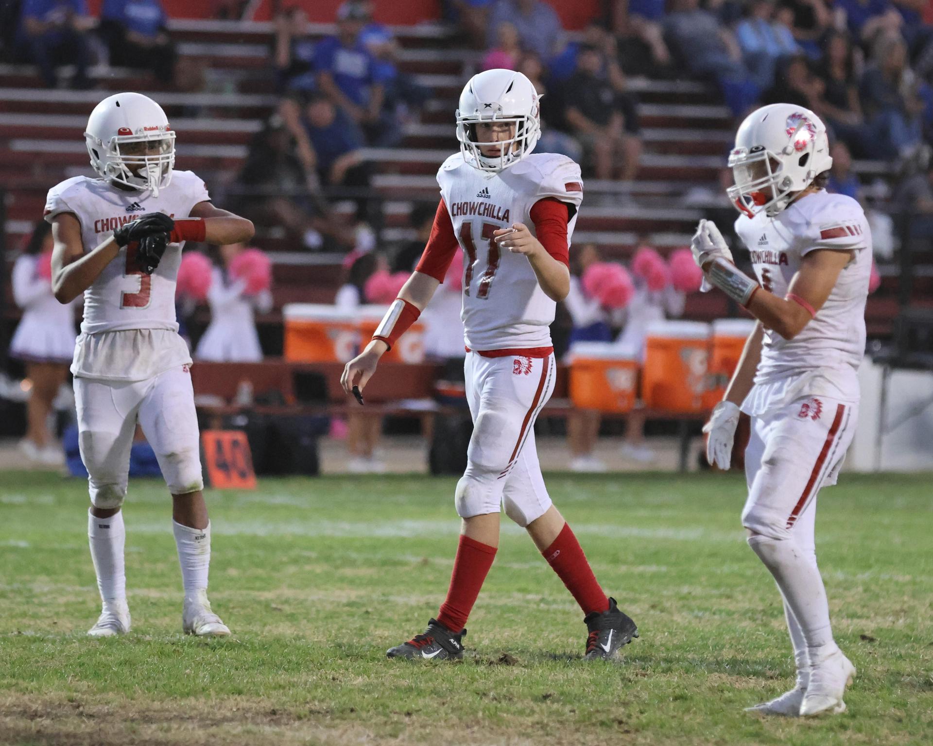 Junior Varsity football players in action against Caruthers