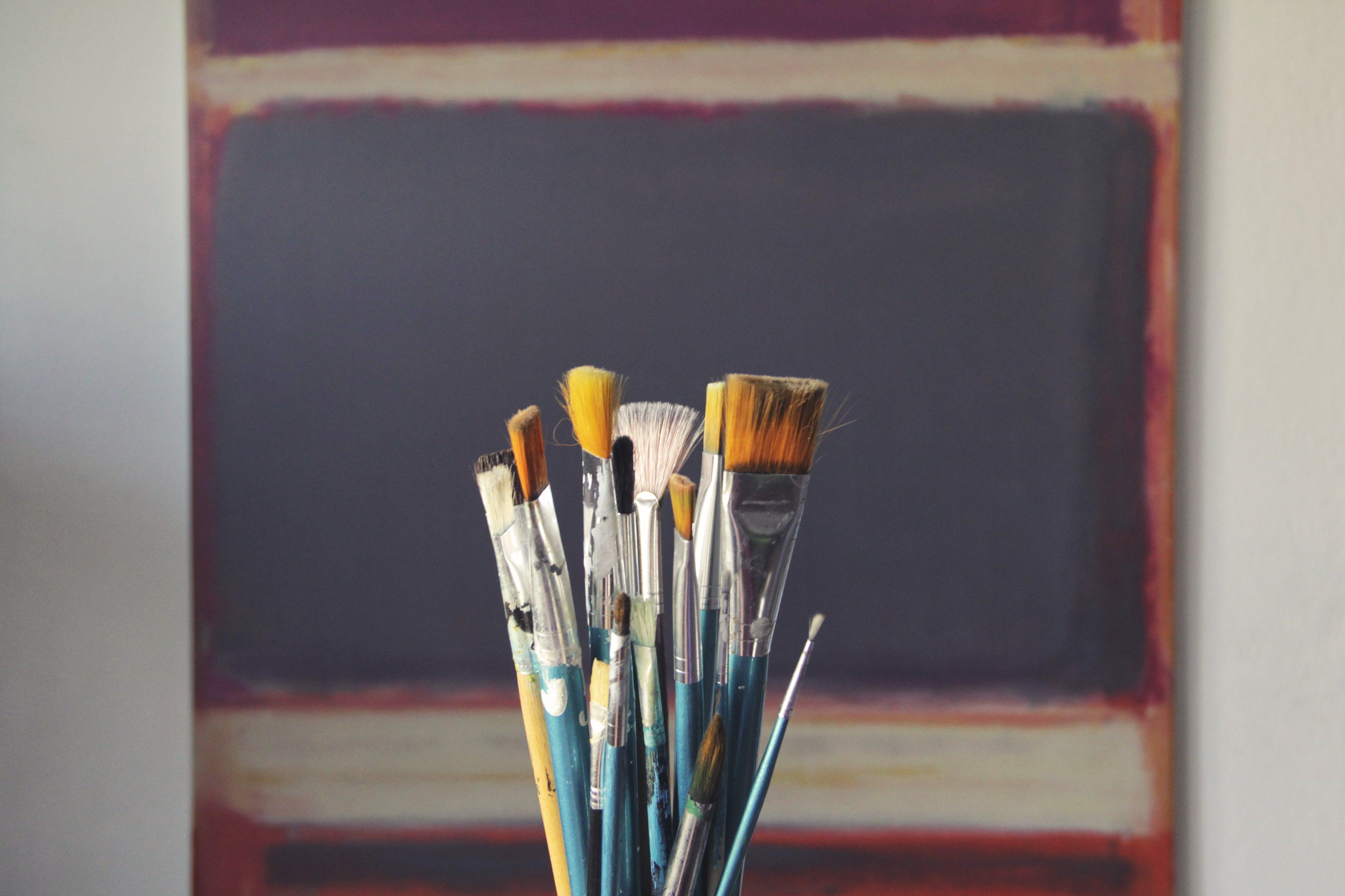 paint brushes in a jar
