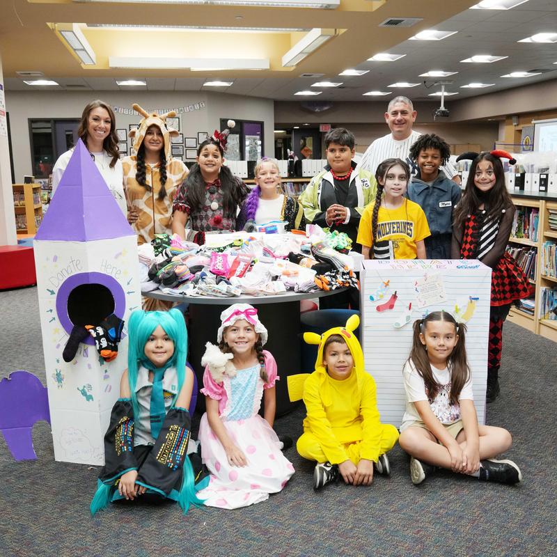 Students and staff with donated socks for Valley Restart