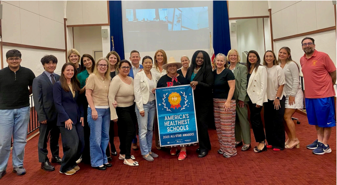Board members, PVPUSD staff, and students gathering for a picture celebrating award for Healthiest Schools