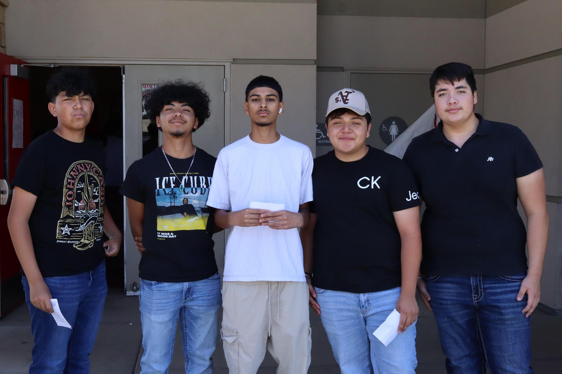 Students and staff posing at tribe turnout