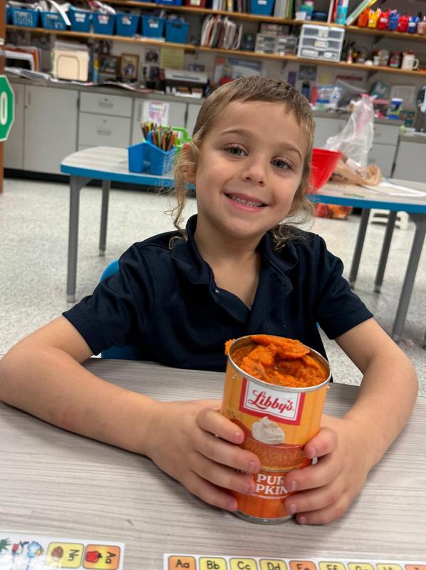 A student holds a can of libby's canned pumpkin.