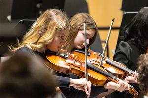 the 7th grade orchestra performs