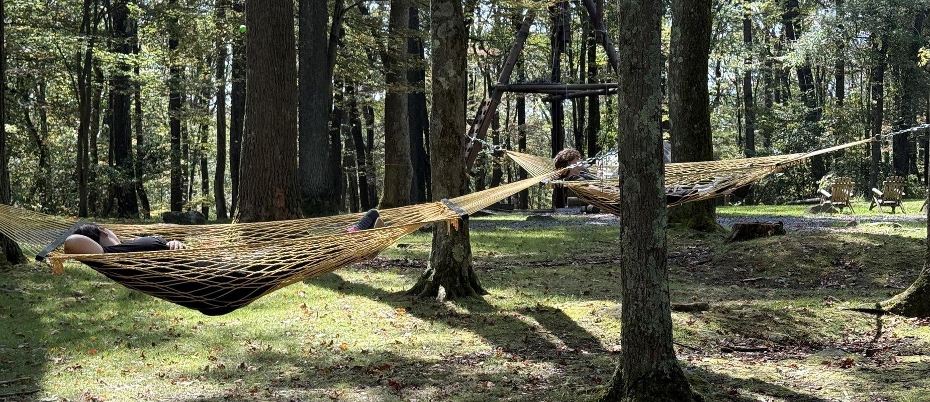 Resting in a hammock during the WVU Outdoor Learning Center adventure