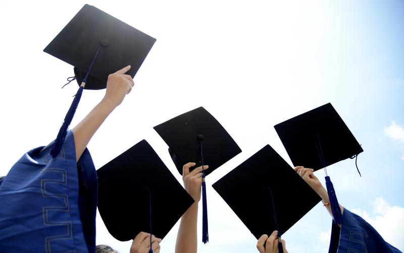 Graduation Caps in Air