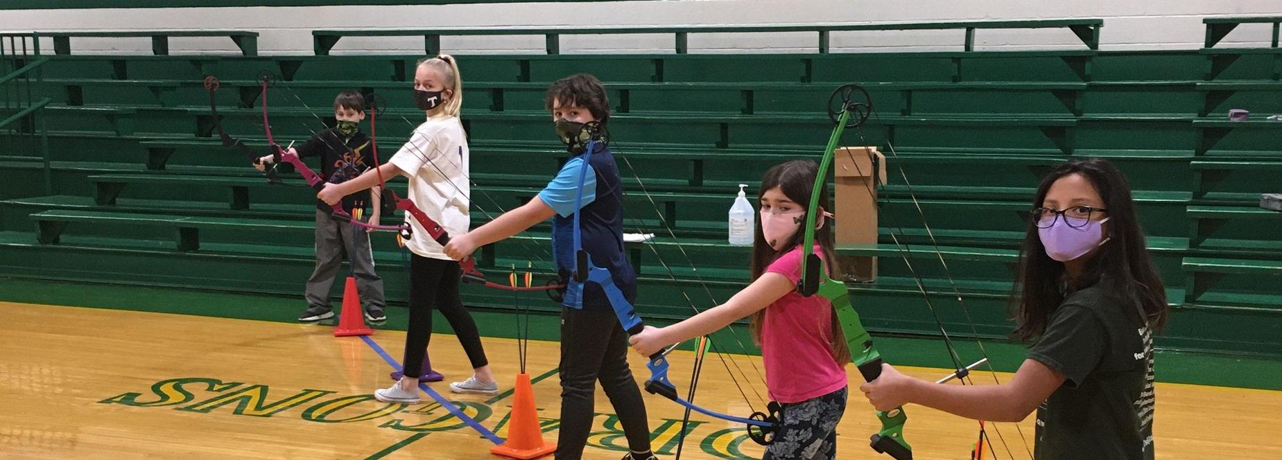 4th graders learning about archery!