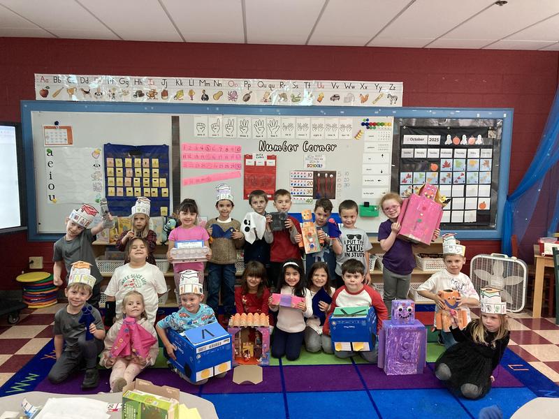 kindergarten students showing off their toy makings creations