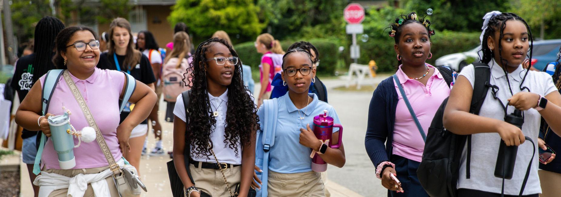 Five girls walk to school