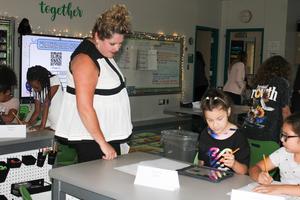 Project Lead The Way students demonstrate a project to administrators