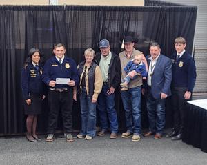 Reilly Clapper standing with supporters from Colorado FFA Foundation.