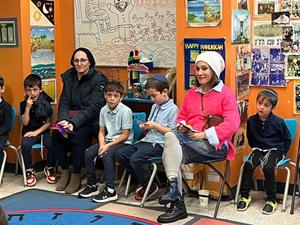 Grandparents enjoy davening with Morah Dena