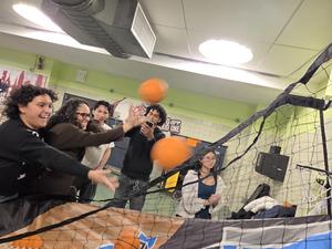 students playing with the little basketball carnival game