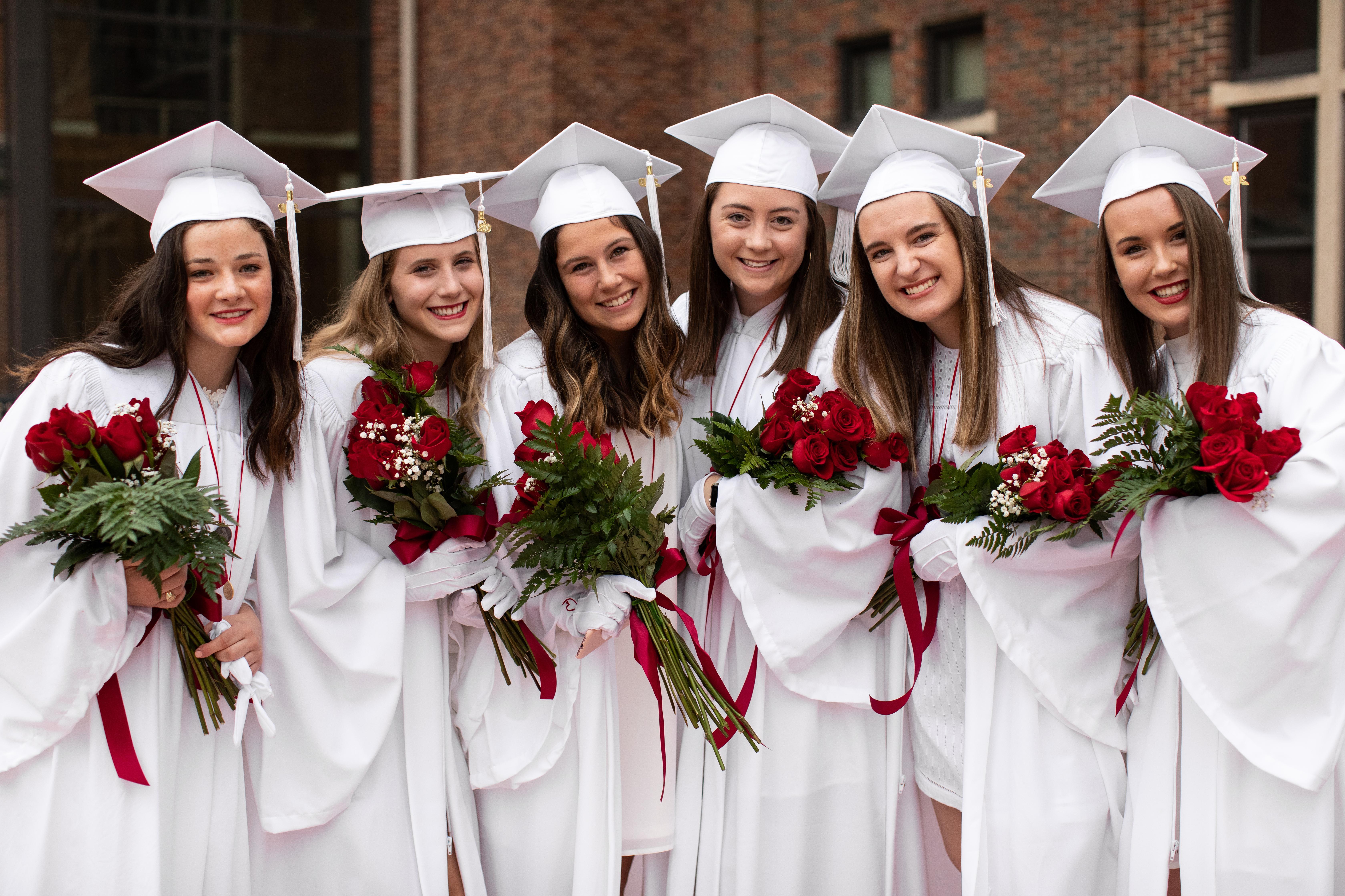 Students in caps and gowns on graduation