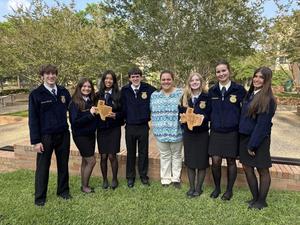 Memorial FFA Agriculture Business Team with their state plaque