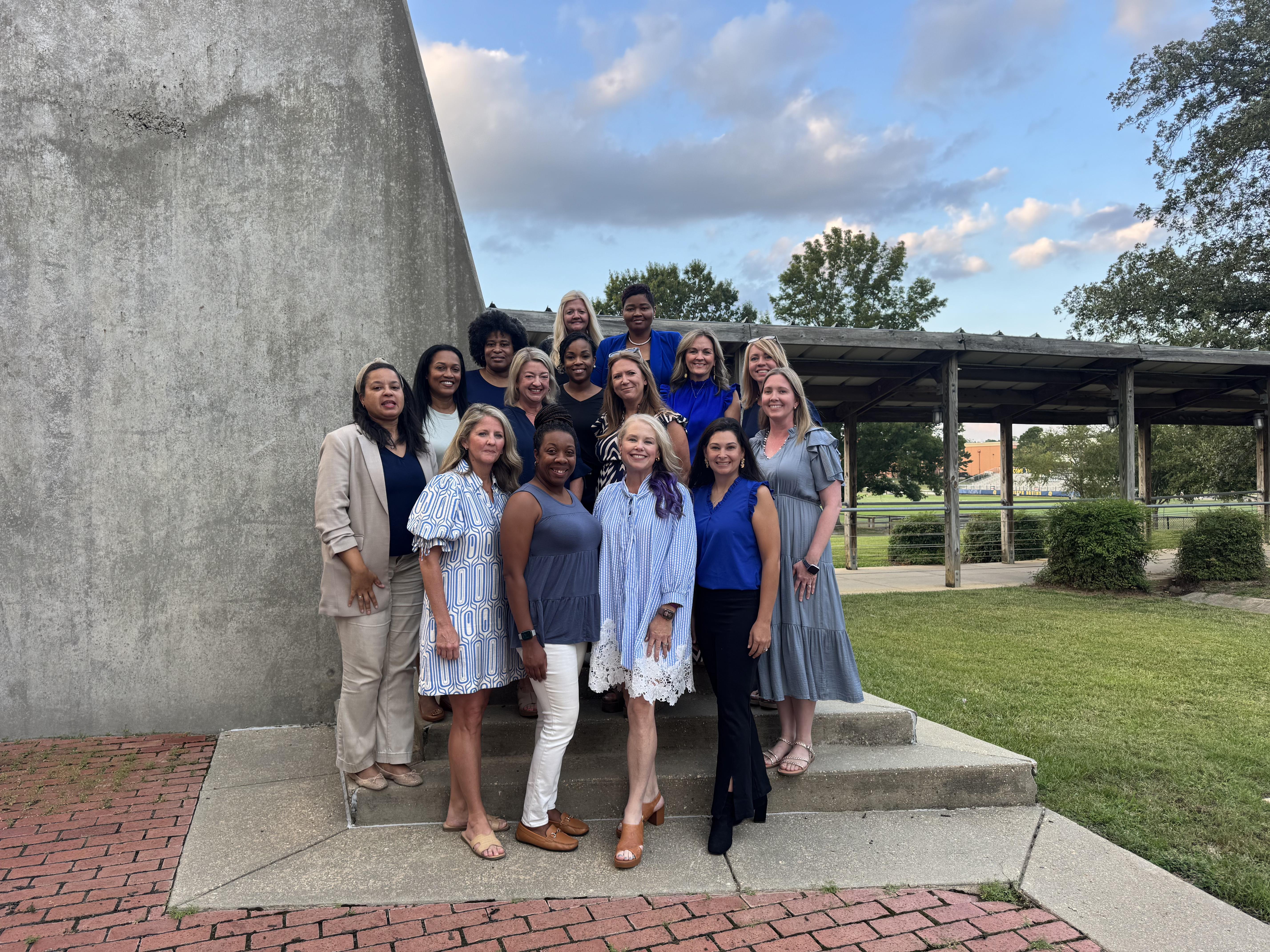 St. Joseph Catholic School Parent Association pose outside the admimistration building