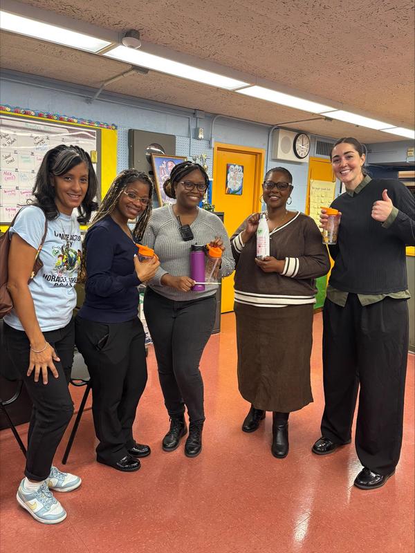 Staff members with their reusable bottles