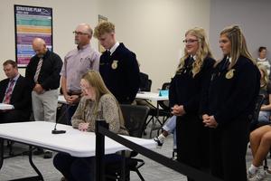 FFA students and coaches speaking at the Board of Trustees meeting