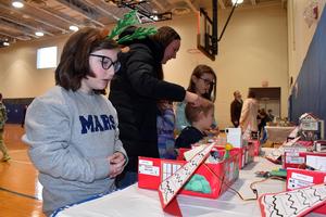 students looking at dioramas based on the movie Home Alone