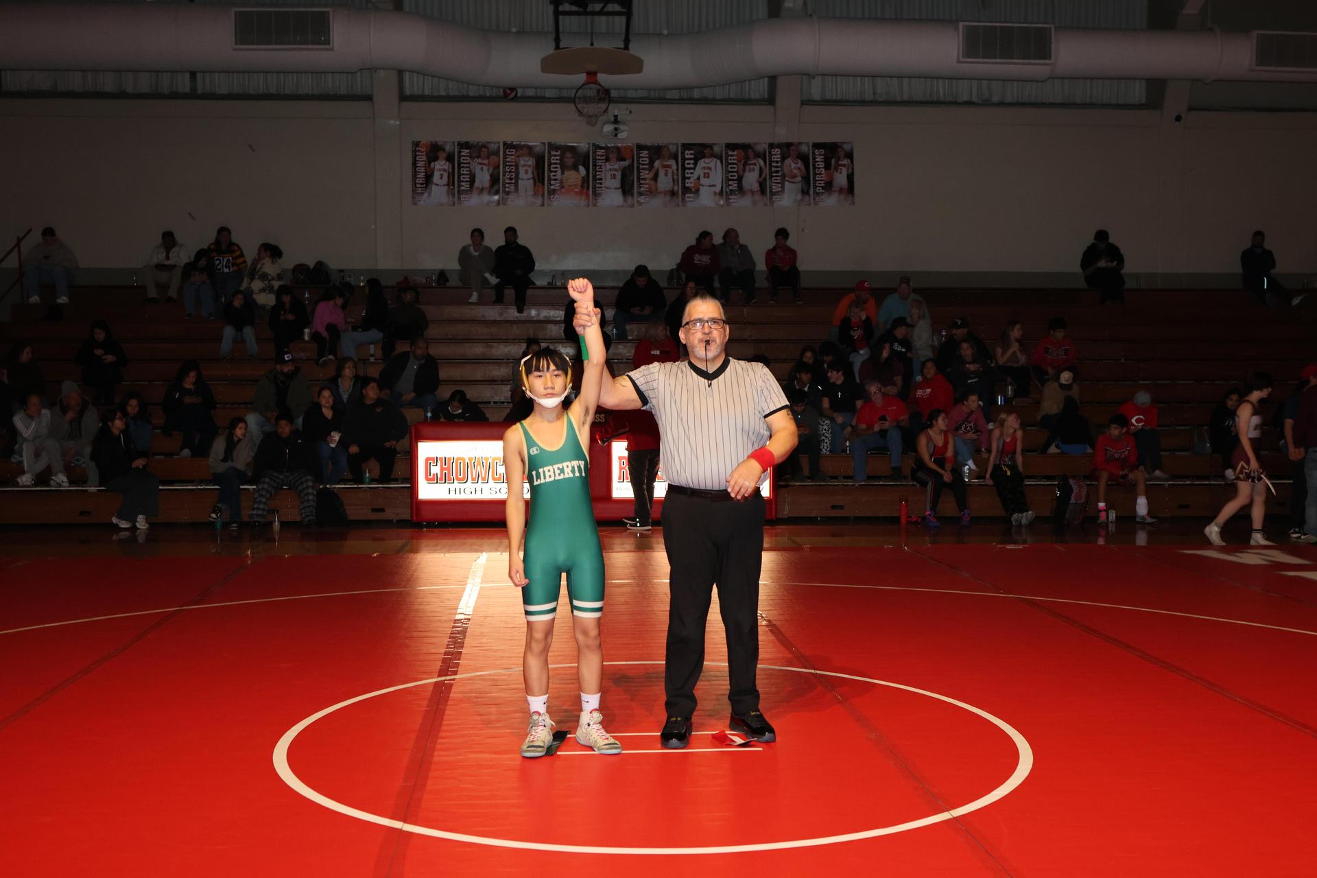 Wrestling winners with hands up 55