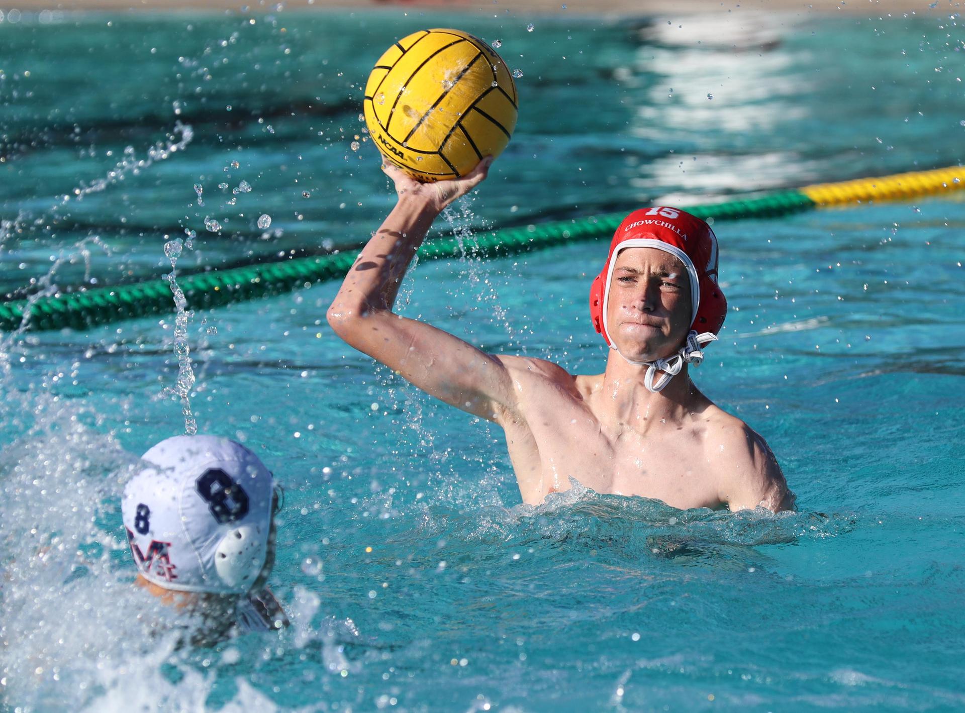 boys water polo players in action against san joaquin memorial