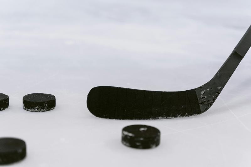 Hockey pucks and stick