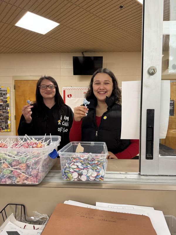 Two students getting dumdums