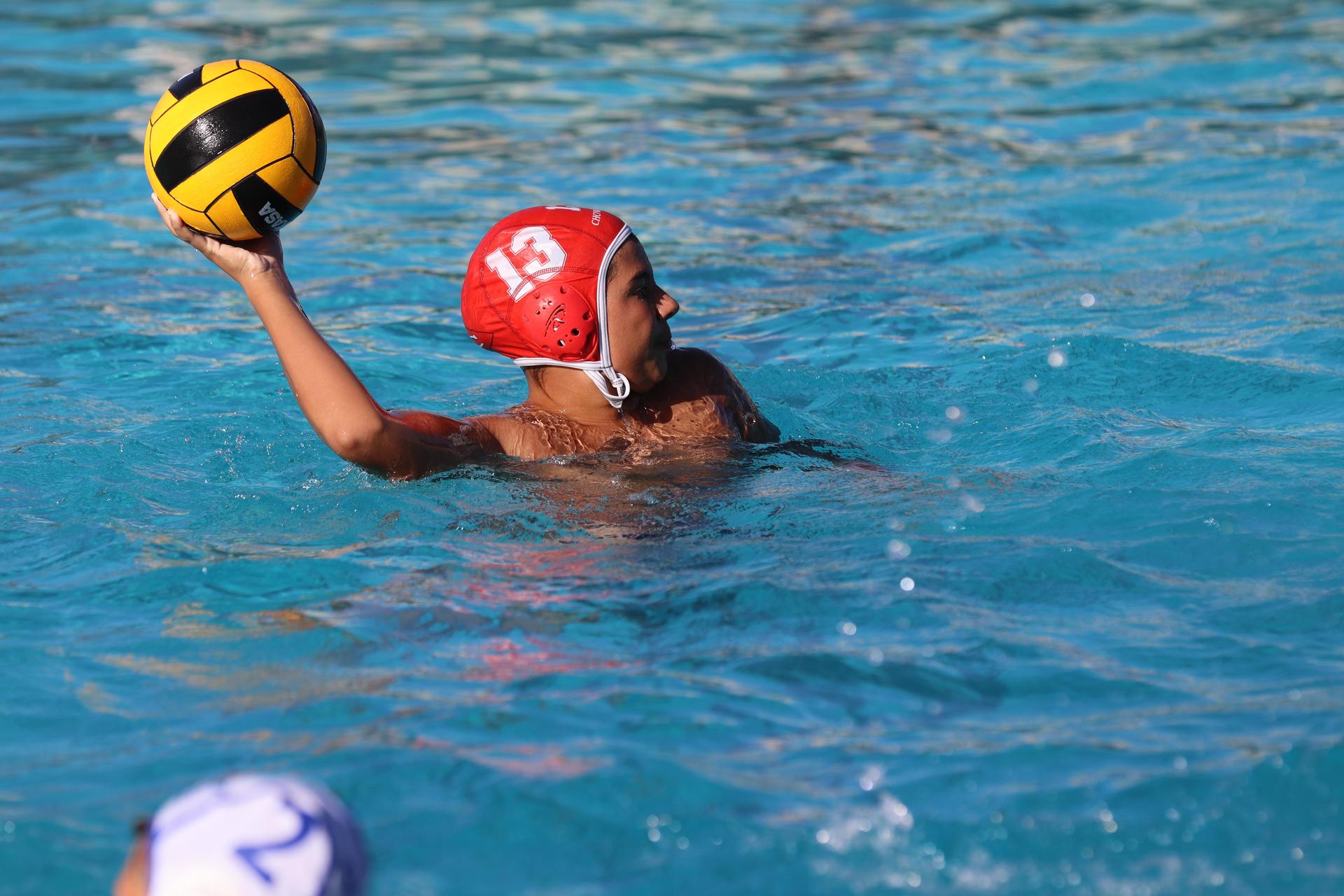 boys playing water polo against Madera